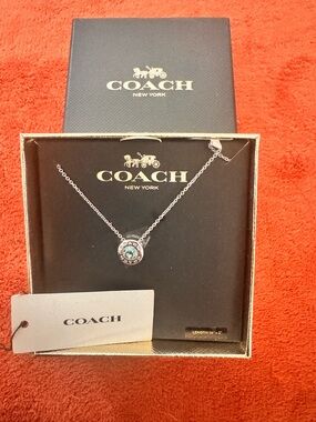 Coach Silver-Tone Necklace with Bluish Green Crystal Accent